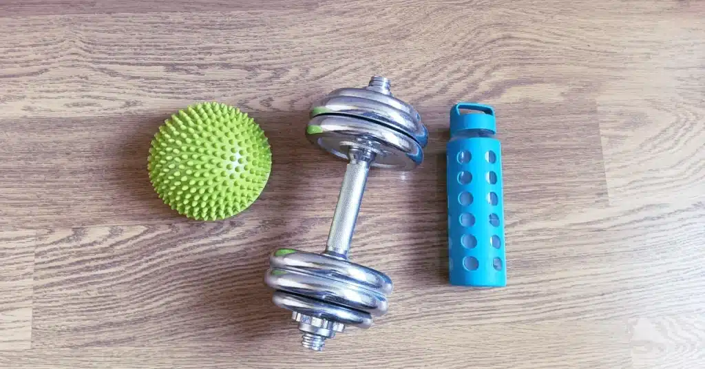 Dumbbell, water bottle and massage ball — simple home workout restart after 40