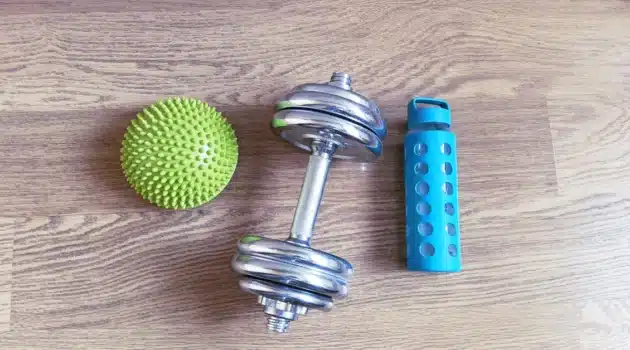Dumbbell, water bottle and massage ball — simple home workout restart after 40